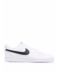 Baskets basses en cuir blanches et noires Nike