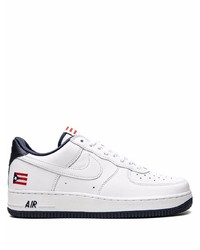 Baskets basses en cuir blanches et noires Nike