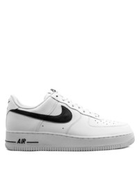 Baskets basses en cuir blanches et noires Nike