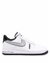 Baskets basses en cuir blanches et noires Nike