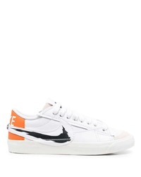 Baskets basses en cuir blanches et noires Nike