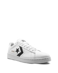 Baskets basses en cuir blanches et noires Converse