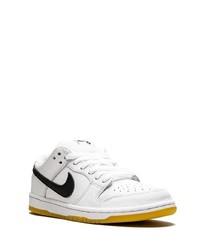 Baskets basses en cuir blanches et noires Nike