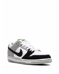 Baskets basses en cuir blanches et noires Nike