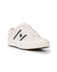 Baskets basses en cuir blanches et noires Converse