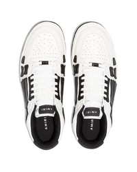 Baskets basses en cuir blanches et noires Amiri