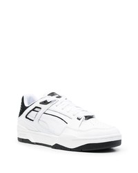 Baskets basses en cuir blanches et noires Puma