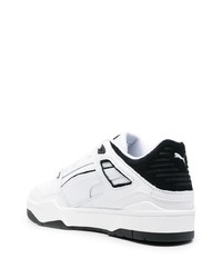 Baskets basses en cuir blanches et noires Puma