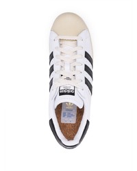 Baskets basses en cuir blanches et noires adidas