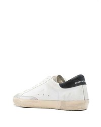 Baskets basses en cuir blanches et noires Golden Goose