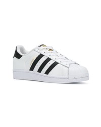 Baskets basses en cuir blanches et noires adidas