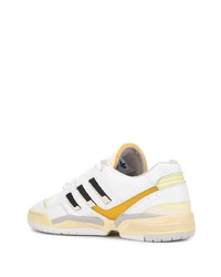 Baskets basses en cuir blanches et noires adidas