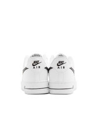 Baskets basses en cuir blanches et noires Nike