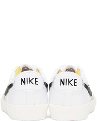 Baskets basses en cuir blanches et noires Nike