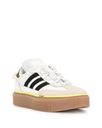 Baskets basses en cuir blanches et noires adidas