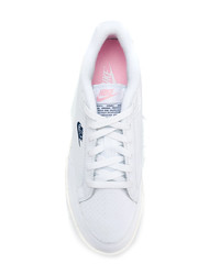 Baskets basses en cuir blanches Nike