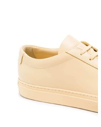 Baskets basses en cuir dorées Common Projects