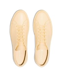 Baskets basses en cuir dorées Common Projects