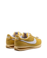 Baskets basses en cuir dorées Nike