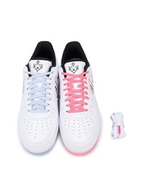 Baskets basses en cuir imprimées blanches et noires Nike