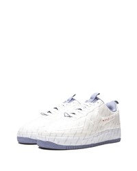 Baskets basses en cuir imprimées blanches Nike