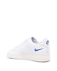 Baskets basses en cuir imprimées blanches Nike