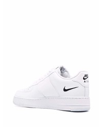 Baskets basses en cuir imprimées blanches Nike