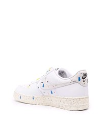 Baskets basses en cuir imprimées blanches Nike