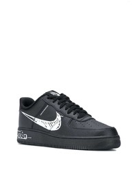 Baskets basses en cuir imprimées noires et blanches Nike