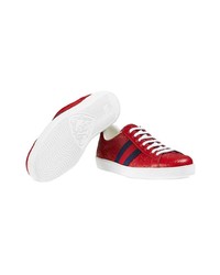 Baskets basses en cuir imprimées rouges Gucci