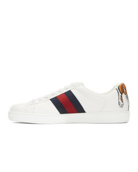 Baskets basses en cuir imprimées serpent blanches Gucci