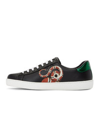 Baskets basses en cuir imprimées serpent noires Gucci