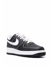 Baskets basses en cuir noires et blanches Nike