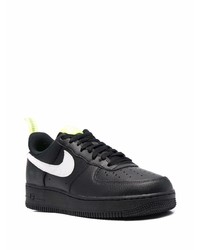 Baskets basses en cuir noires et blanches Nike