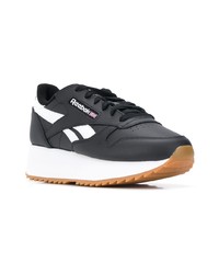 Baskets basses en cuir noires et blanches Reebok