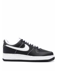 Baskets basses en cuir noires et blanches Nike