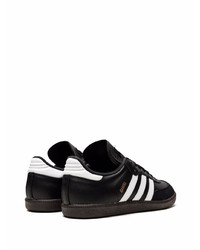 Baskets basses en cuir noires et blanches adidas