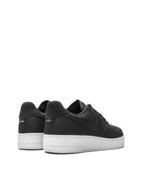 Baskets basses en cuir noires Nike