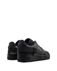 Baskets basses en cuir noires Nike