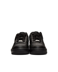 Baskets basses en cuir noires Nike