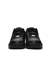 Baskets basses en cuir noires Nike