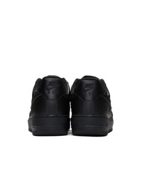 Baskets basses en cuir noires Nike