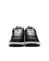 Baskets basses en cuir noires Nike