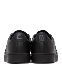 Baskets basses en cuir noires Converse