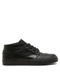 Baskets basses en cuir noires Nike