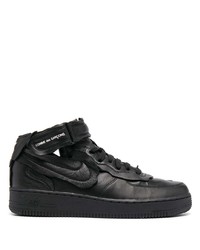 Baskets basses en cuir noires Nike