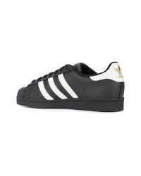 Baskets basses en cuir noires adidas