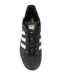 Baskets basses en cuir noires adidas