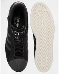 Baskets basses en cuir noires adidas