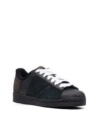 Baskets basses en cuir noires adidas